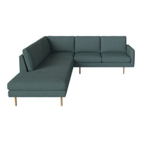 Teal sectional sofa with a clean design and textured fabric, featuring wooden legs for a modern touch.