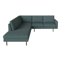 Teal L-shaped sectional sofa with clean lines and subtle textured pattern, featuring wooden legs for a modern touch.