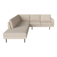 Beige sectional sofa with a smooth fabric texture and minimalist design, featuring clean lines and neutral tones.