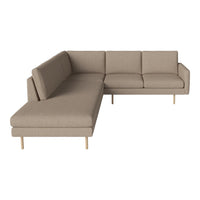 Beige sectional sofa with a modern design and clean lines, featuring subtle texture and light wooden legs.