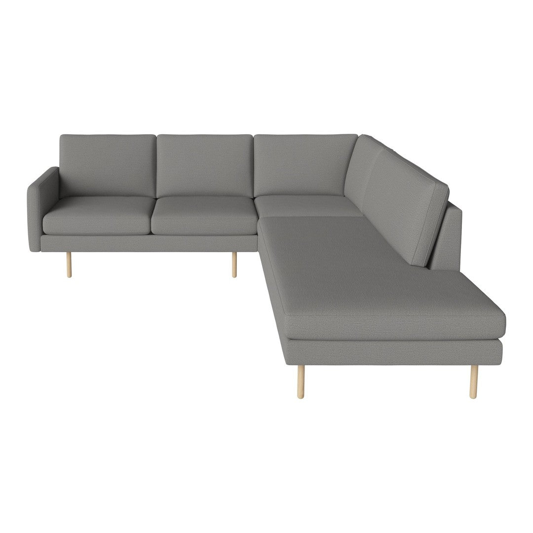Modern gray sectional sofa with sleek lines and a minimalist design, featuring light wooden legs.
