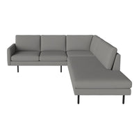 Modern gray sectional sofa with clean lines and minimalistic design, featuring a solid color and no patterns.