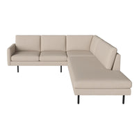 Beige sectional sofa with a minimalist design and sleek black legs, showcasing a clean, modern pattern.