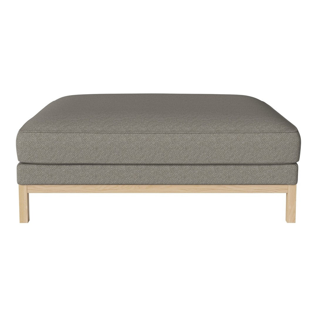 Gray upholstered ottoman with a smooth texture, featuring a minimalist wooden base. Ideal for modern interiors.