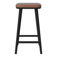 Black wooden stool with a smooth, tan leatherette seat, featuring a minimalist, modern design.