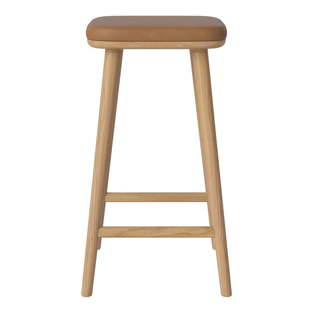 Natural wood bar stool with a smooth, tan cushioned seat, featuring simple, minimalist design.