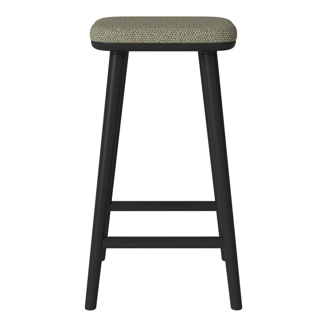 Black wooden bar stool with a textured light green fabric seat. Simple, modern design enhances any decor.
