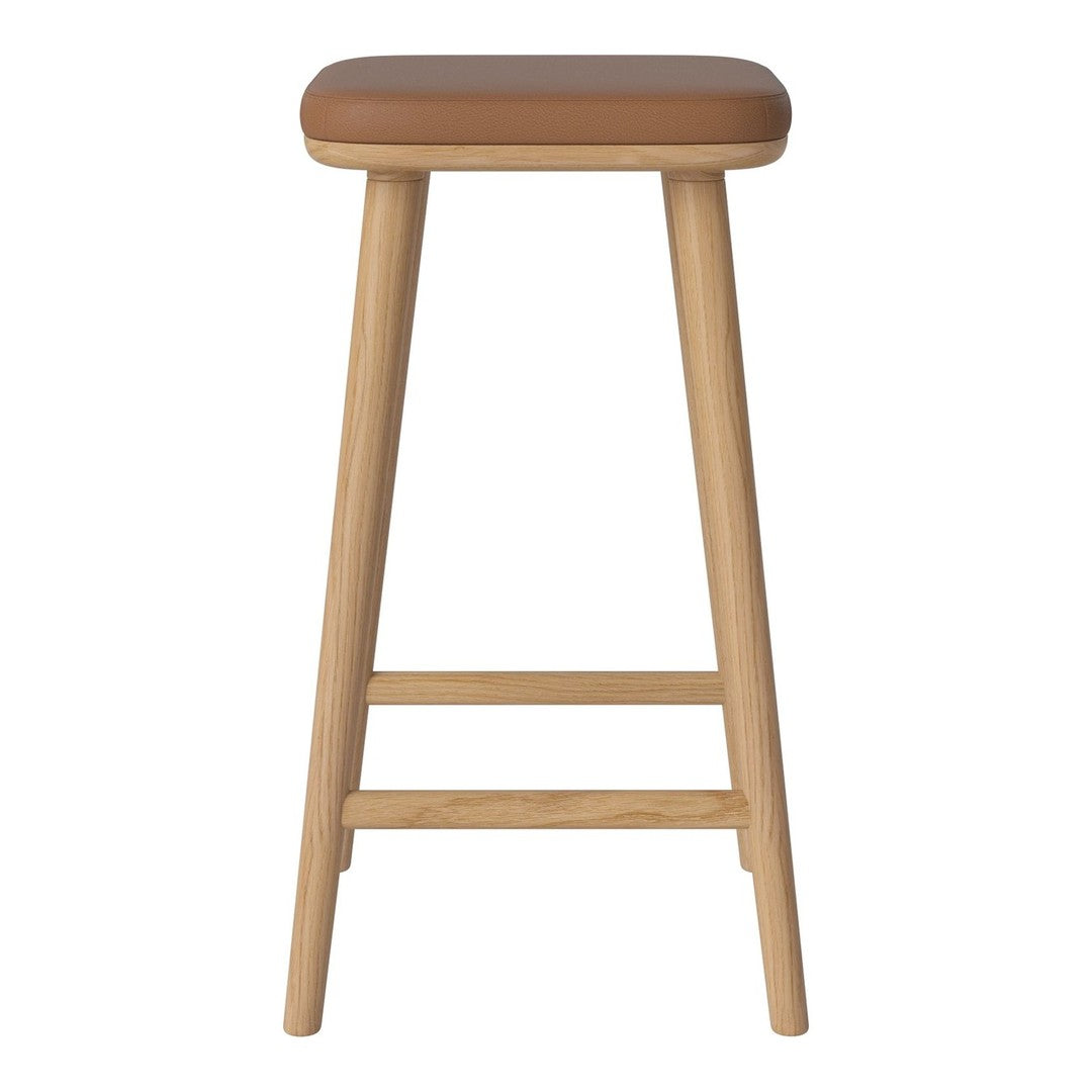 Brown cushioned seat with natural wood legs, featuring a simple, minimalist design for versatile decor.