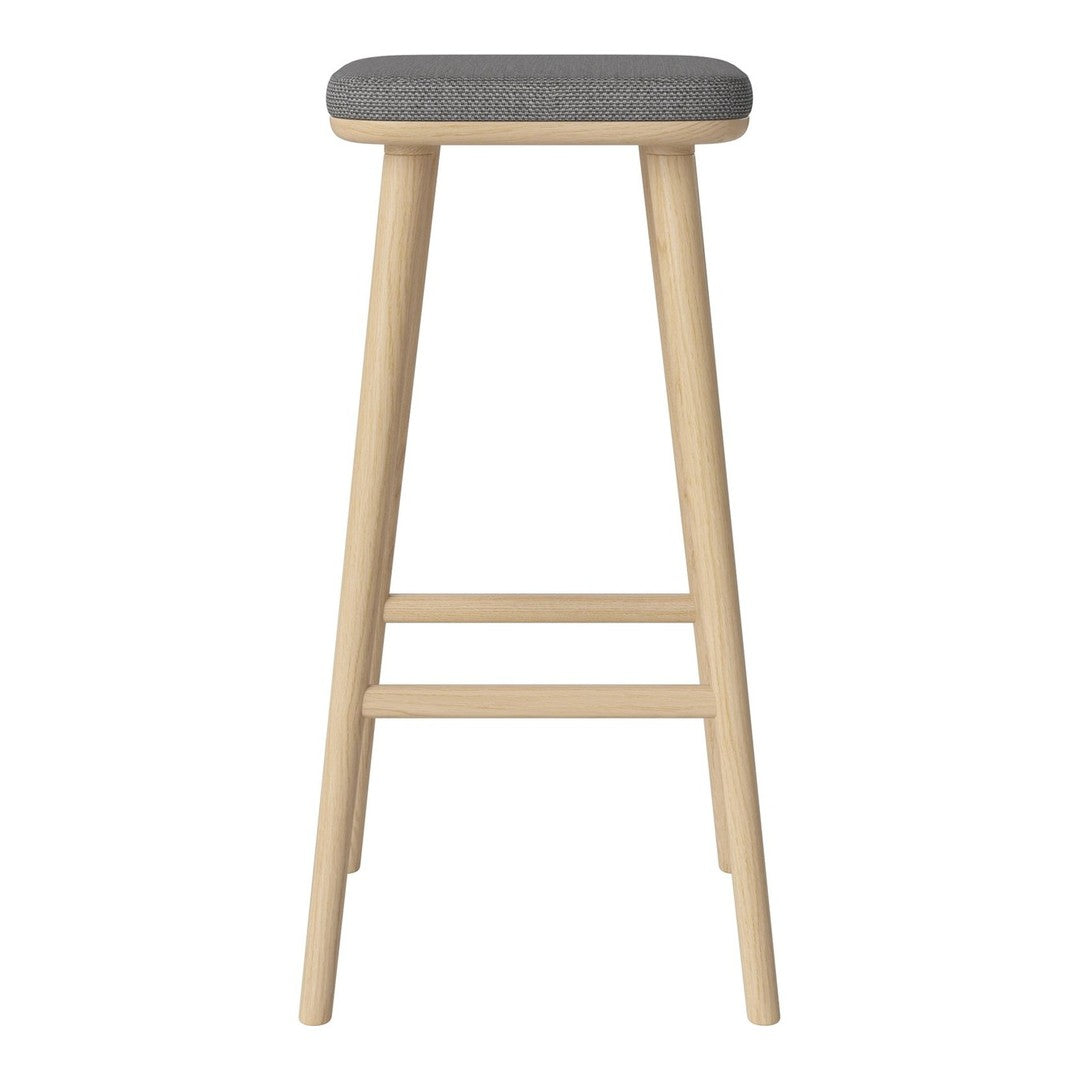 Light wood bar stool with a sleek gray upholstered seat, featuring a simple design and clean lines.