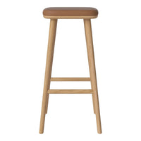 Tall wooden bar stool with a smooth tan seat and natural wood legs for a minimalist look.