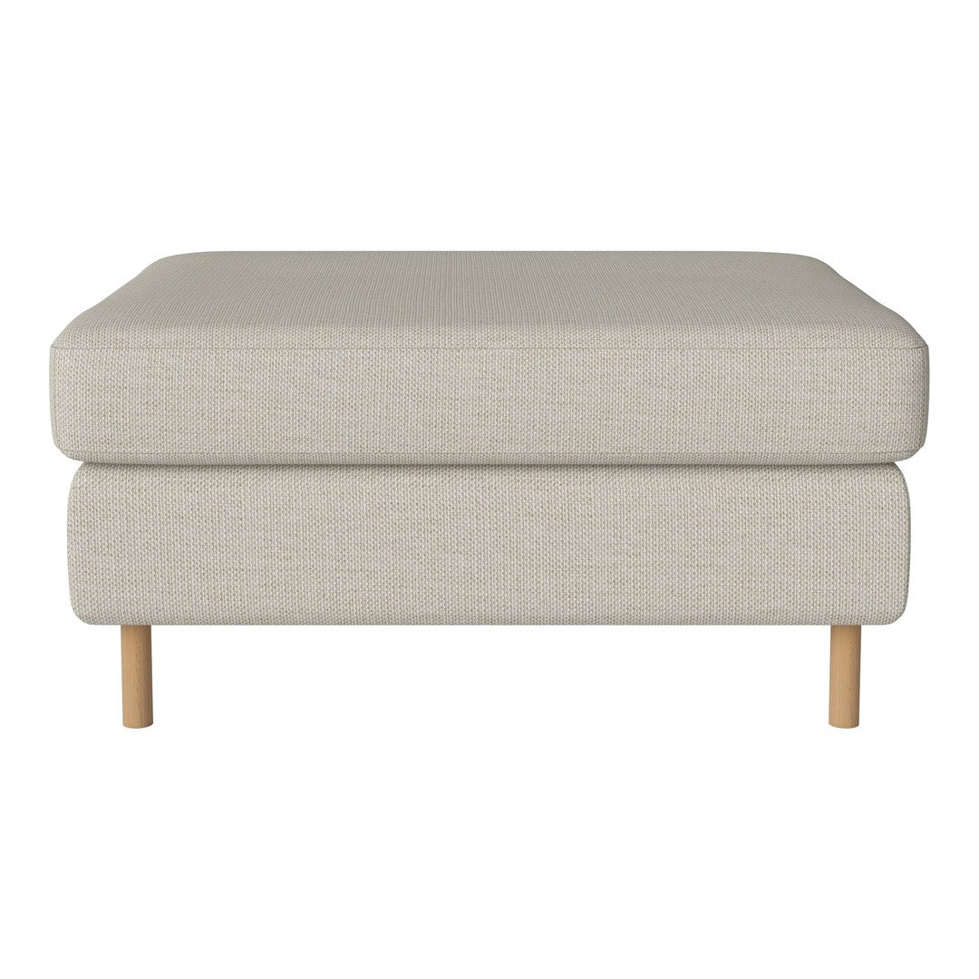 Light beige ottoman with a smooth fabric surface and natural wood legs, perfect for modern decor.
