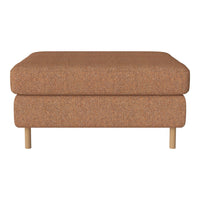 Rust-colored upholstered ottoman with a smooth texture and natural wooden legs, featuring a minimalist design.