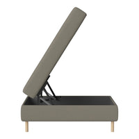 Gray upholstered storage bed frame with a soft fabric finish and light wood legs. Sleek, minimalist design.