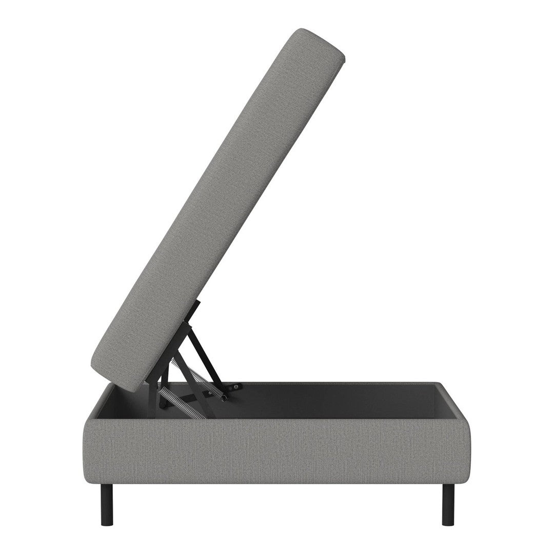 Gray upholstered storage bed with a smooth, minimalist design and sleek black legs. Perfect for modern decor.
