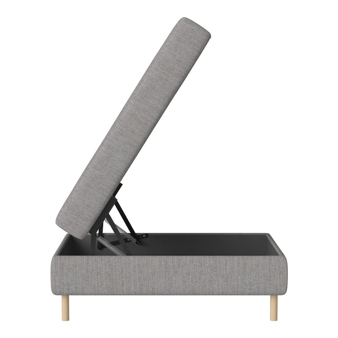 Grey upholstered storage ottoman with light wood legs and a clean, modern design. Perfect for contemporary decor.