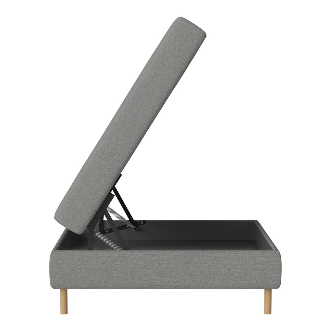 Grey upholstered storage ottoman with natural wood legs and a minimalist design. Perfect for modern decor.