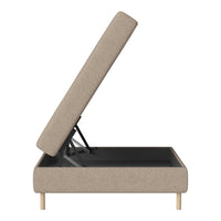 Beige upholstered storage bed with natural wood legs, featuring a clean, modern design and minimalist aesthetic.