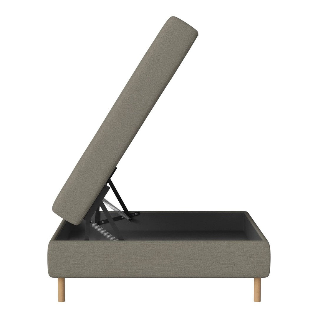 Storage ottoman in muted gray fabric with wooden legs and a simple, modern design. Perfect for minimalist decor.