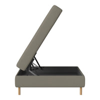 Storage ottoman in muted gray fabric with wooden legs and a simple, modern design. Perfect for minimalist decor.