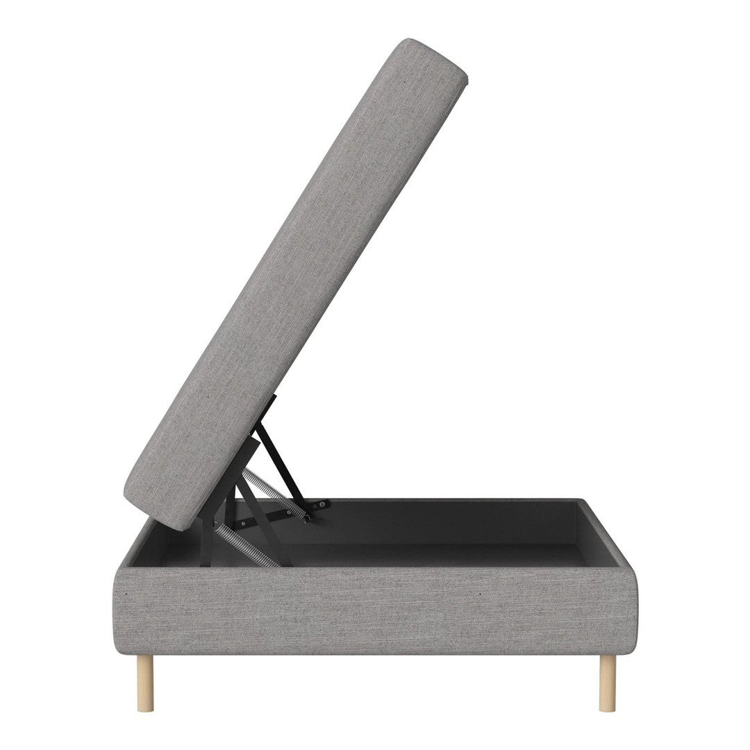Gray upholstered storage bed with a light wood base and a sleek, minimalist design.