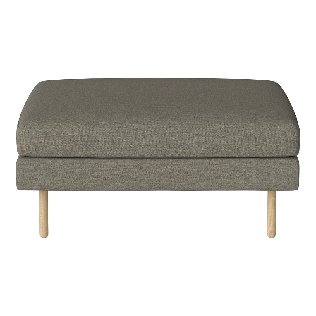 Olive green upholstered ottoman with a smooth texture and light wooden legs. Simple, modern design.