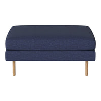 Navy blue upholstered ottoman with a textured pattern and light wooden legs. Ideal for modern living spaces.