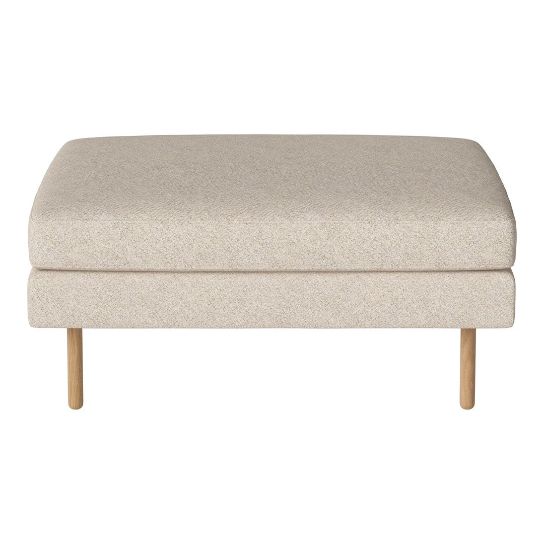 Neutral beige upholstered ottoman with a subtle textured pattern and light wooden legs. Perfect for modern decor.