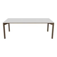 Modern white tabletop with brown wooden legs, featuring a sleek, minimalist design. Perfect for any dining area.