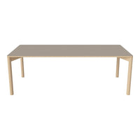 Beige tabletop with natural wood legs, sleek and minimal design for modern dining spaces. 