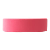 Round pink velvet cushion with a smooth surface, perfect for modern decor or playful accent pieces.