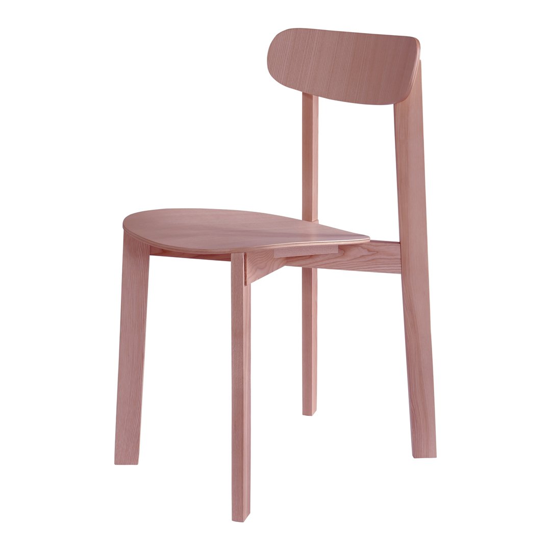 Light pink wooden chair with a minimalist design and smooth, curved patterns. Perfect for modern decor.