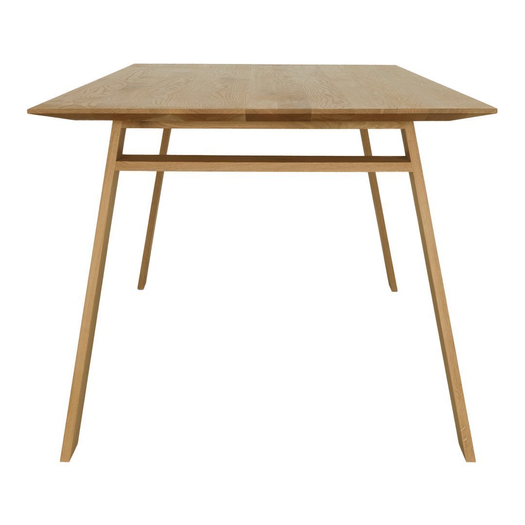 Natural wood dining table with a smooth finish and minimalist design, featuring light oak color and simple geometric lines.