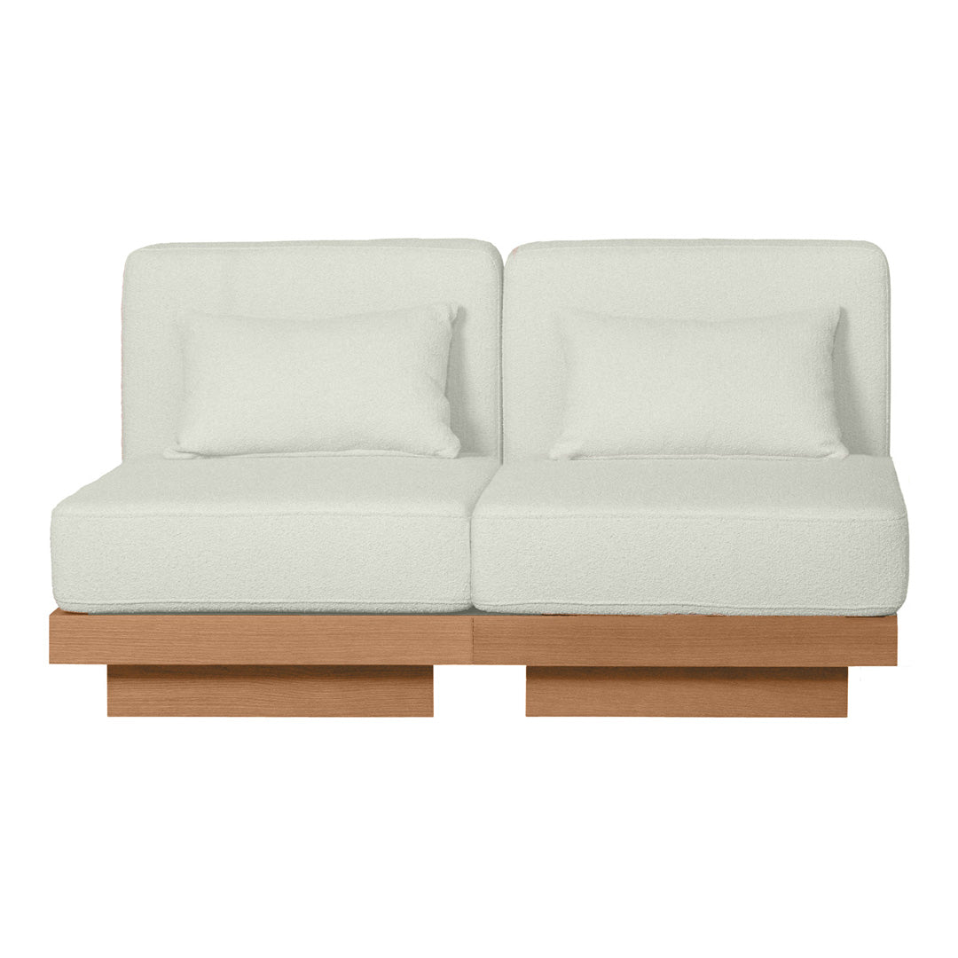 Light gray modern couch with two plush seats and wood base, featuring a minimalist design and clean lines.