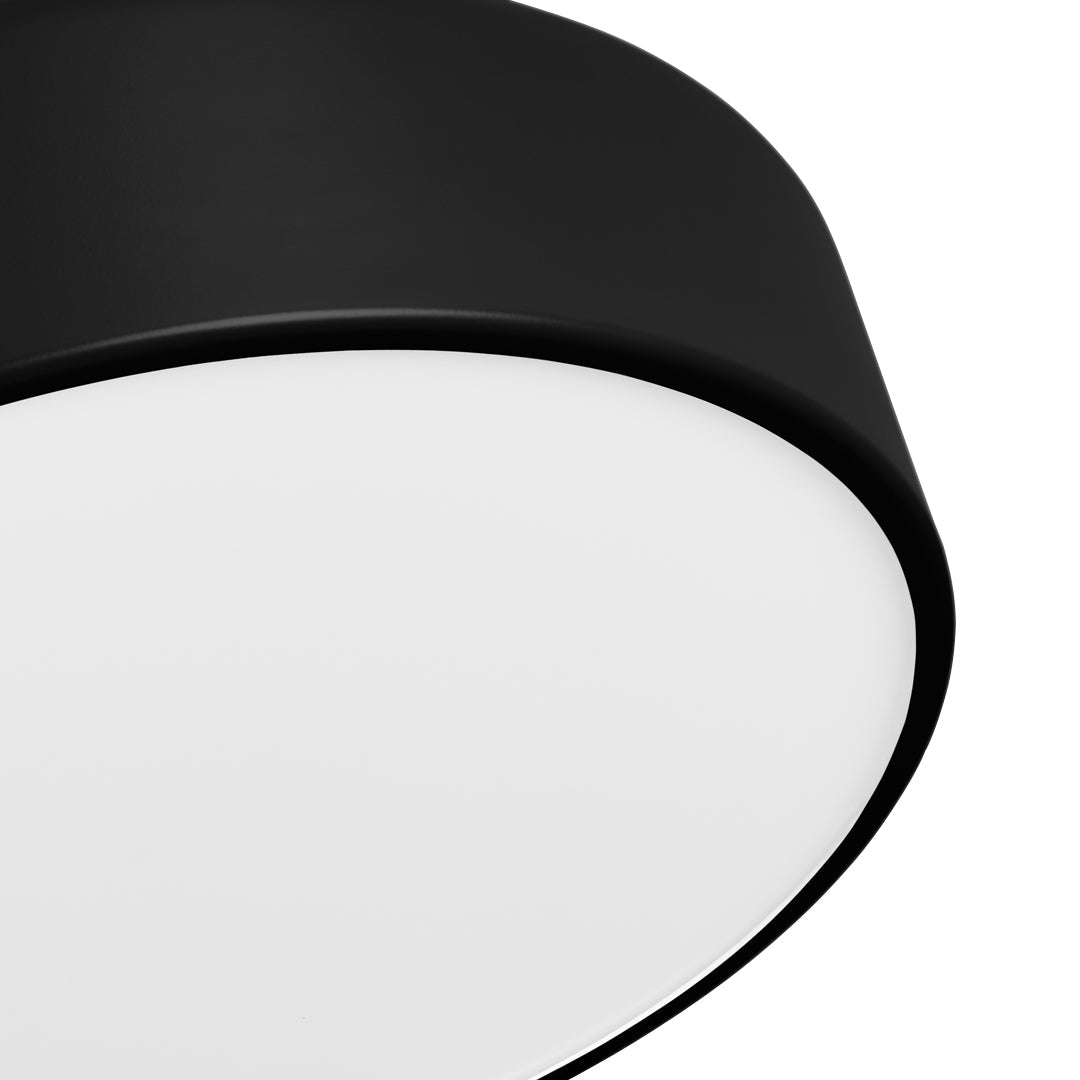 Black circular lamp with a smooth white inner surface, offering a modern and minimalistic design.