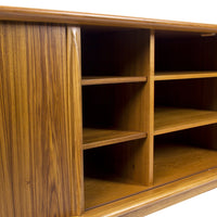 Wooden console in rich, warm tones with a sleek, natural grain pattern. Elegant and minimalist design.