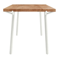 Natural wood grain tabletop with a warm brown finish and sleek white legs. Modern and stylish design for any space.