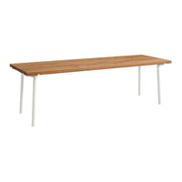 Natural wood table top with a warm oak finish and sleek white metal legs. Modern, minimalist design.