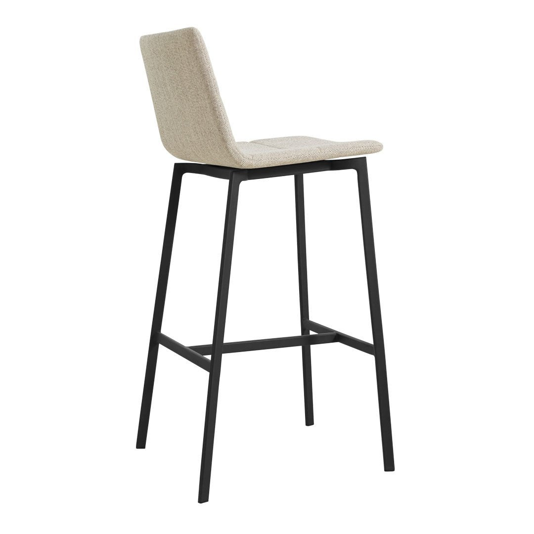 Beige upholstered bar stool with a sleek black metal frame, showcasing a minimalist design and subtle texture.