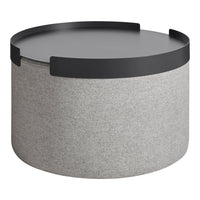 Gray round storage table with a sleek black top and minimalist design. Perfect for modern decor.
