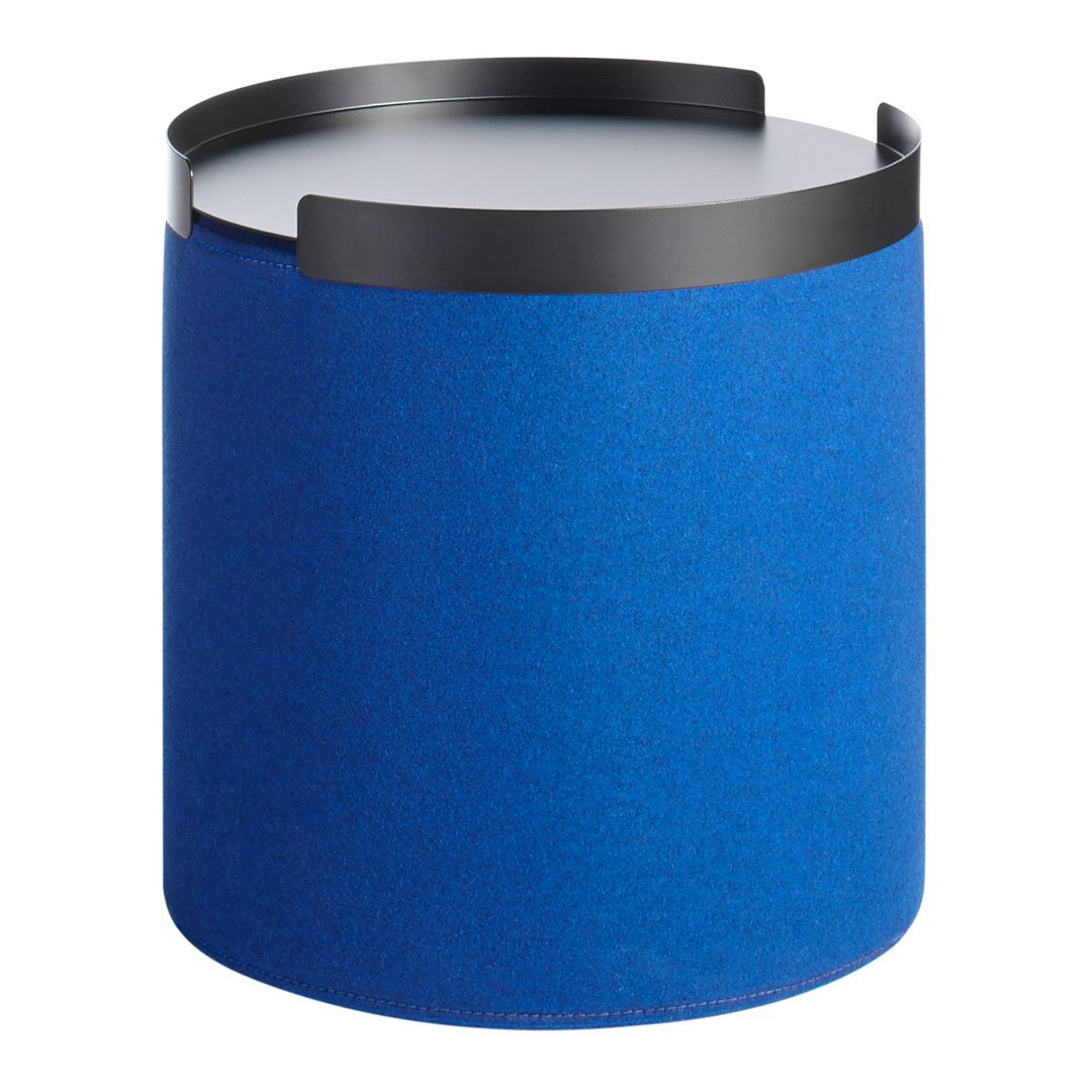 Round ottoman in vibrant blue fabric with a sleek black metal rim, featuring a smooth white top surface.