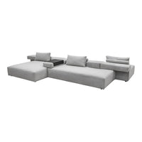 Light gray sectional sofa with a sleek, modern design and clean lines, featuring simple, solid color upholstery.