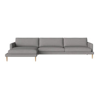Gray sectional sofa with clean lines and minimalist design, featuring plump cushions and wooden legs.