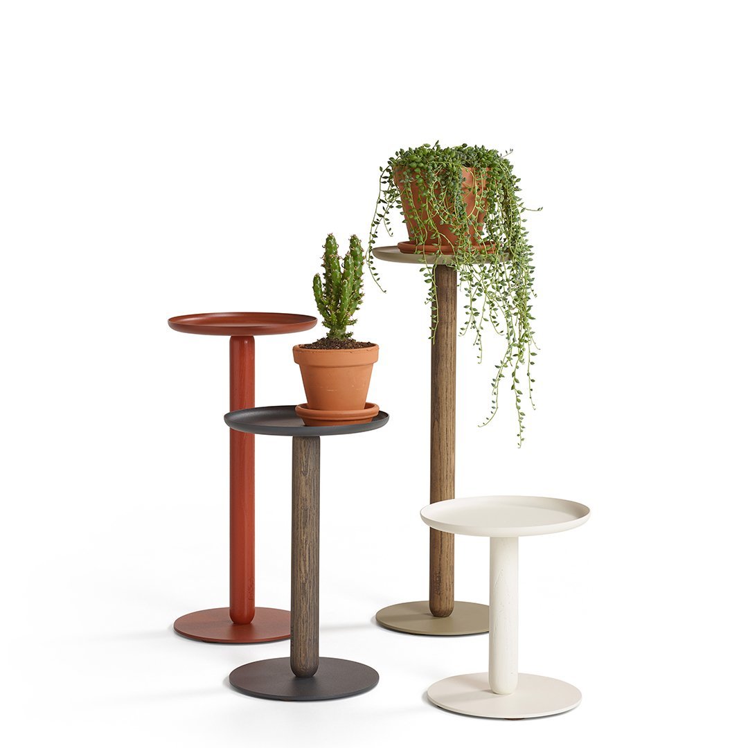 Colorful plant stands featuring earthy tones of terracotta, brown, white, and black with smooth, modern designs.