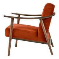 Mid-century modern chair with a vibrant orange velvet cushion and sleek, dark wooden frame.