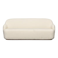 Creamy white, plush sofa with a soft, textured surface, perfect for modern decor. Elegant and minimalist design.