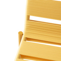 Yellow striped chair with sleek lines and modern design, featuring a vibrant, sunny hue. Perfect for stylish decor.