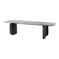 Stylish black table with a textured gray speckled top, smooth edges, and bold, modern black legs.