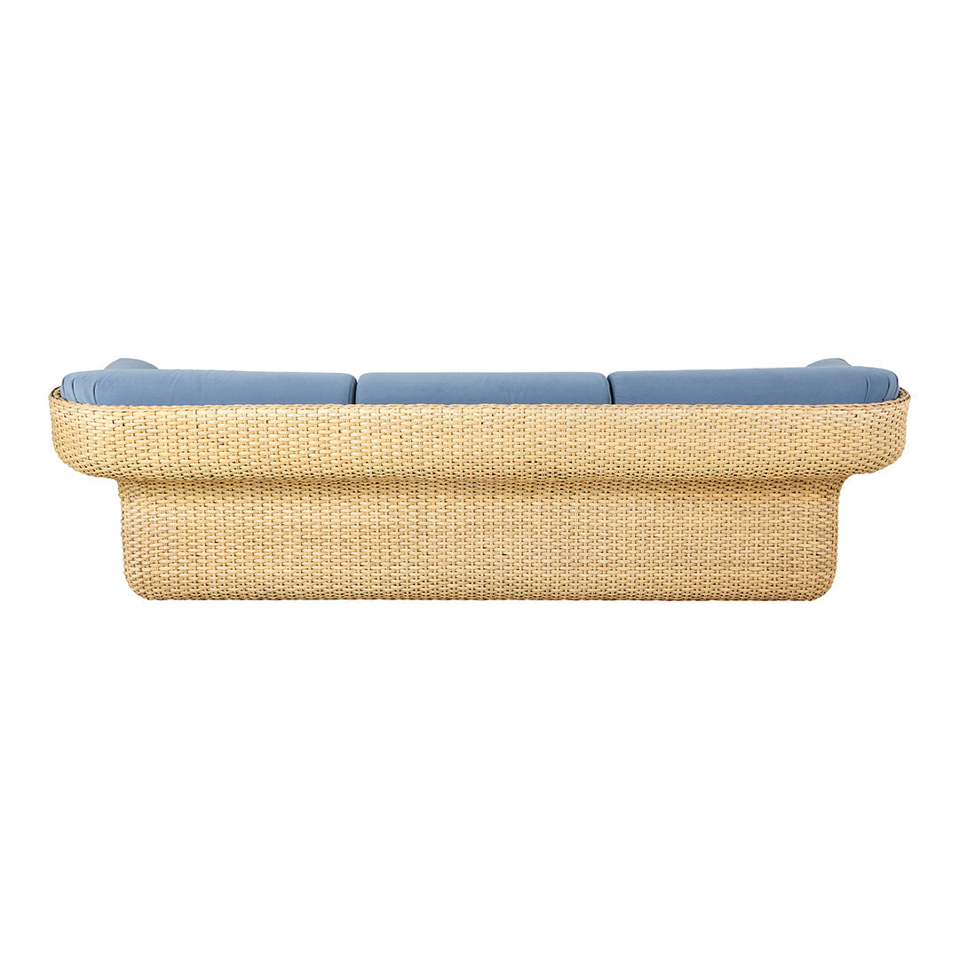 Light blue cushions on a woven beige sofa with a textured pattern, perfect for modern decor.