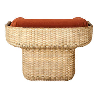 Natural woven texture in light beige, complemented by a rich orange cushion, creating a stylish contrast.