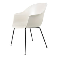 Modern white chair with a sleek curved design and black metal legs, perfect for minimalist decor.